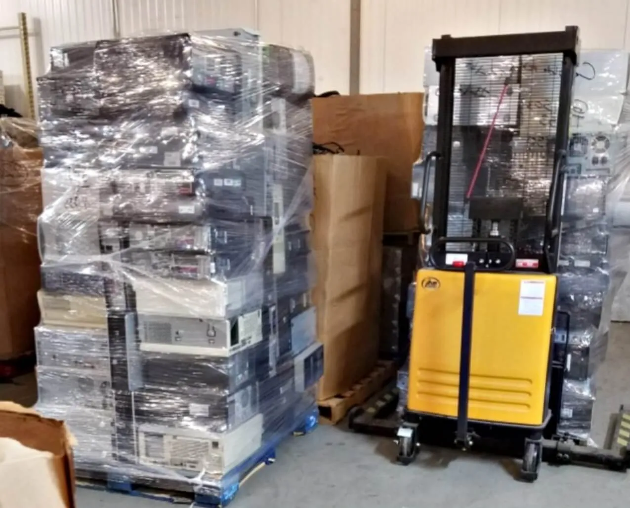 PC Recyclers truck loading equipment at a customer site